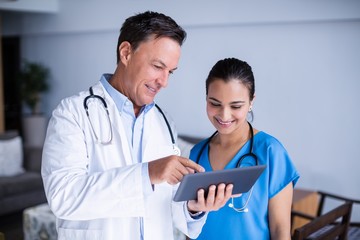 Wall Mural - Doctors using digital tablet