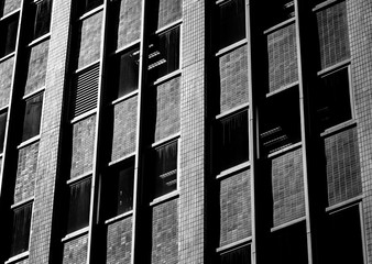 windows of commercial building in Hong Kong with B&W color
