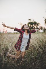 Portrait of young beautiful woman in sunset.