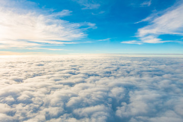 Sunrise above clouds from airplane window .