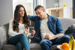 © Bojan - Girlfriend showing something on smart phone to her boyfriend.