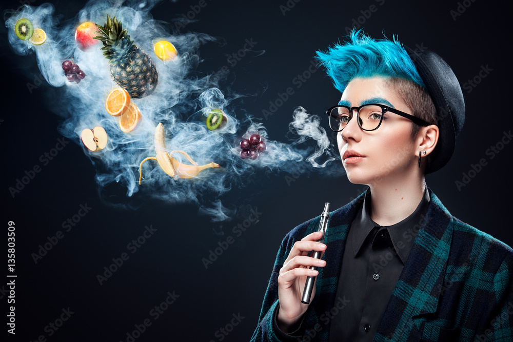 hipster woman with blue hair smoking fruit electronic cigarette on black  background. Vape advertisement concept. Copy space Stock Photo | Adobe Stock