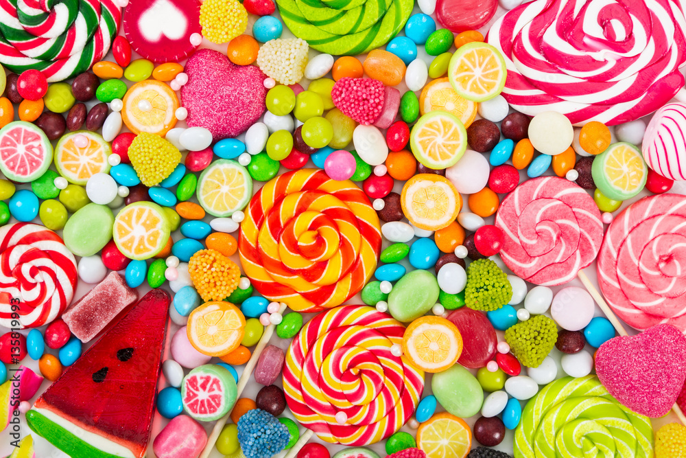 Colorful lollipops and different colored round candy. - obrazy, fototapety, plakaty 