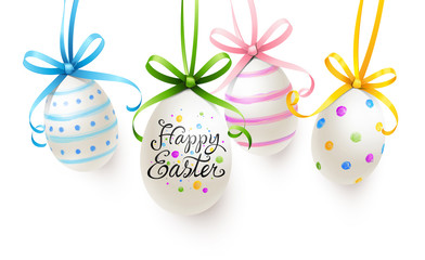 Wall Mural - Group of hanging easter eggs painted with colorful pattern, lettering and curled bows - Happy Easter