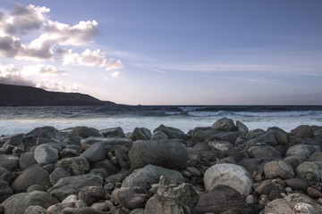 Canvas Print - A view of a rock beach.