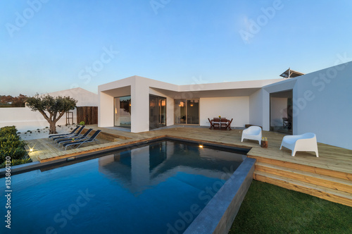 Fotografie, Obraz Modern house with garden swimming pool and wooden deck