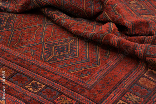 Fotografie, Obraz Close up of a hand woven and knotted afghan berjesta mashwani kilim rug