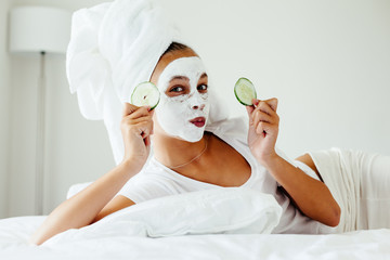 Wall Mural - Teenage girl making facial mask