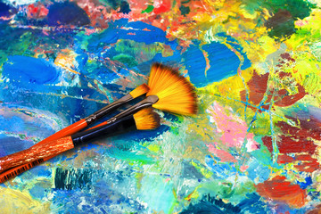 artist's palette with oil paints and brushes