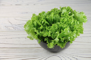 fresh green lettuce in a bowl