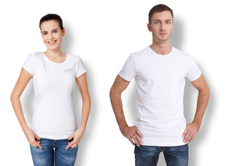 Wall Mural - Shirt design and people concept - close up of young man and woman in blank white t-shirt with shadow isolated.