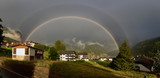 Fototapeta Tęcza - Rainbow over Selva di Val Gardena in a rainy end of the day