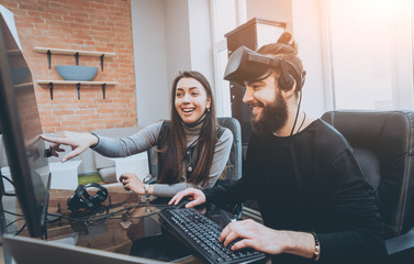 Wall Mural - The young man with girlfriend plays a game at the office.