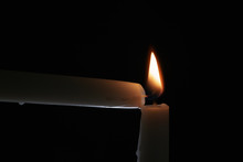 Ighting Tall Candle With Another Candle In The Dark, Shallow Focus