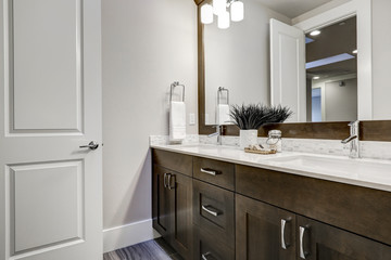 Wall Mural - White and brown bathroom boasts a nook filled with double vanity