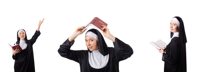 Wall Mural - Pretty nun with Bible isolated on white