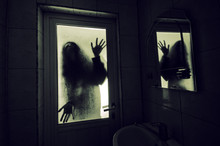 Horror Woman In Window Wood Hand Hold Cage Scary Scene Halloween Concept Blurred Silhouette Of Witch