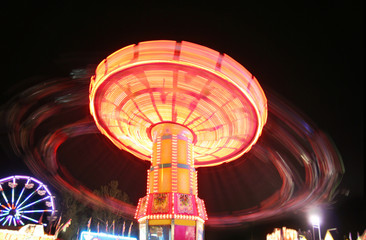  a fair ride during dusk on a warm summer evening toned with a r