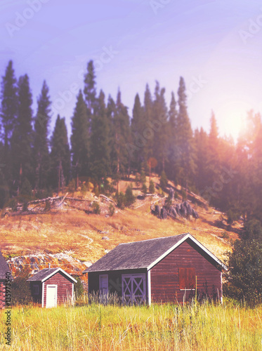 A Cabin Or Barn In The Woods Toned With A Retro Vintage Filter I