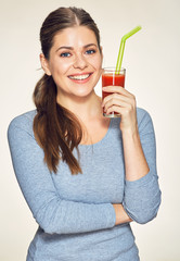 Canvas Print - young smiling woman with long hair holding glass with red juice.