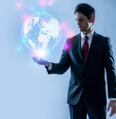 Poster - young businessman looking at a abstract object floating on her hands, communication network concept.