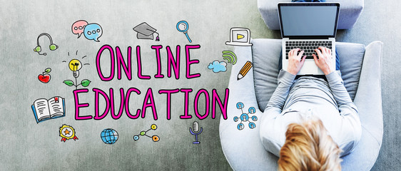Wall Mural - online education text with man using a laptop