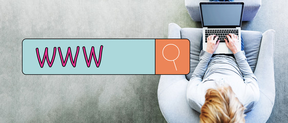 Wall Mural - www text with man using a laptop
