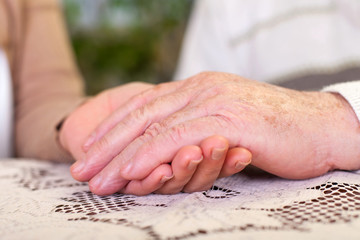 Sticker - Elderly hands holding carer's hands