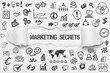 © magele-picture - Marketing Secrets / weißes Papier mit Symbole