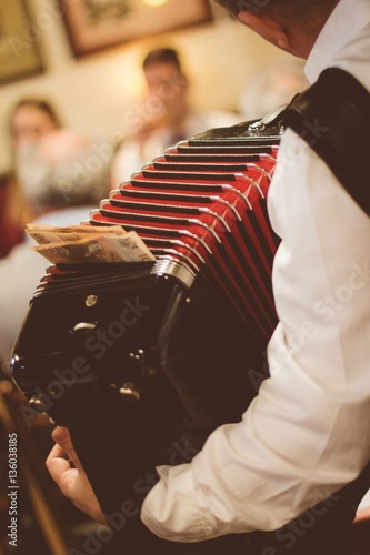 Cuadros en Lienzo Man playing accordion in serbian bar
