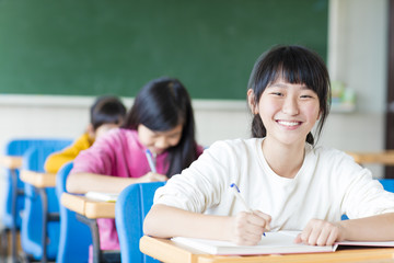 Canvas Print - happy teenager girl learning in the classroom