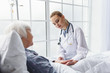 © Yakobchuk Olena - Smiling therapeutic setting drip bulb to patient