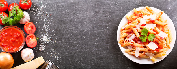 Canvas Print - plate of penne pasta with tomato sauce and parmesan