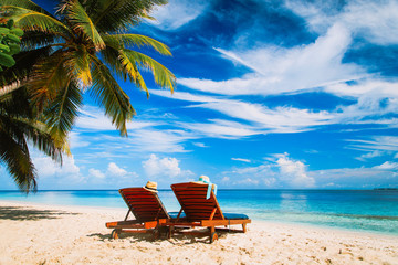 Two chairs on the tropical beach