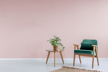 Pink room with green armchair