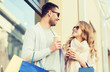 © Syda Productions - happy couple with shopping bags and coffee in city