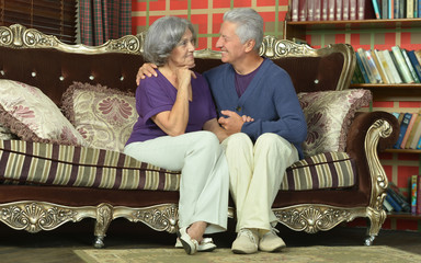 Canvas Print - beautiful elderly couple on sofa