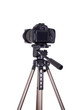 modern dslr camera with blank screen on tripod isolated on white