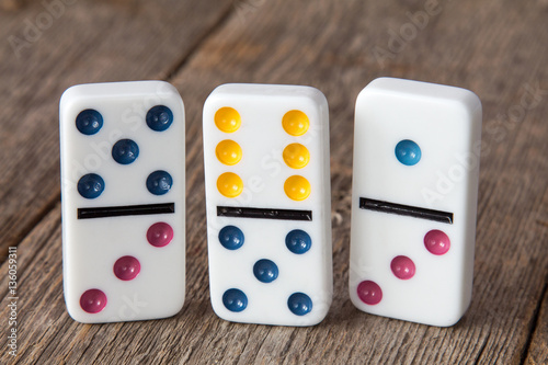 Photographie Three dominoes with colorful dots
