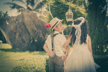 Little Girl And Boy In Wedding Dress With Old Classic Style Ston
