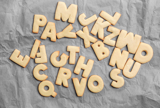 Cookie alphabet on crumpled paper, closeup