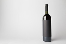 Wine Bottle Is Standing On Gray Background