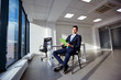 © Studio Romantic - Businessman with documents in the hands of  modern office.
