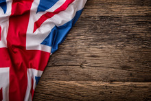 Flag Of UK  On Old Wooden Background. Union Jack  Flag On Old Oak Background.