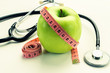 © masanyanka - Losing weight - green apple, measuring tape and stethoscope