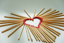 Closeup Of Matchsticks Arranged To Form A Heart