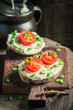 Tasty sandwich with fromage cheese, chive and cherry tomatoes