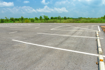 Wall Mural - Empty parking lot on blue sky background