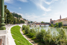 Sunny View Of Adige River And Stone Bridge (Ponte Di Pietra) In Verona, Veneto Region, Italy.
