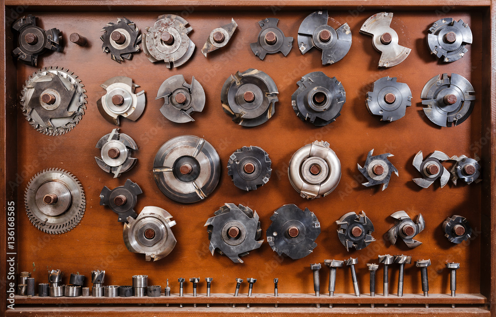 Composition of circular saws and milling cutters. Carpenter tools on a ...